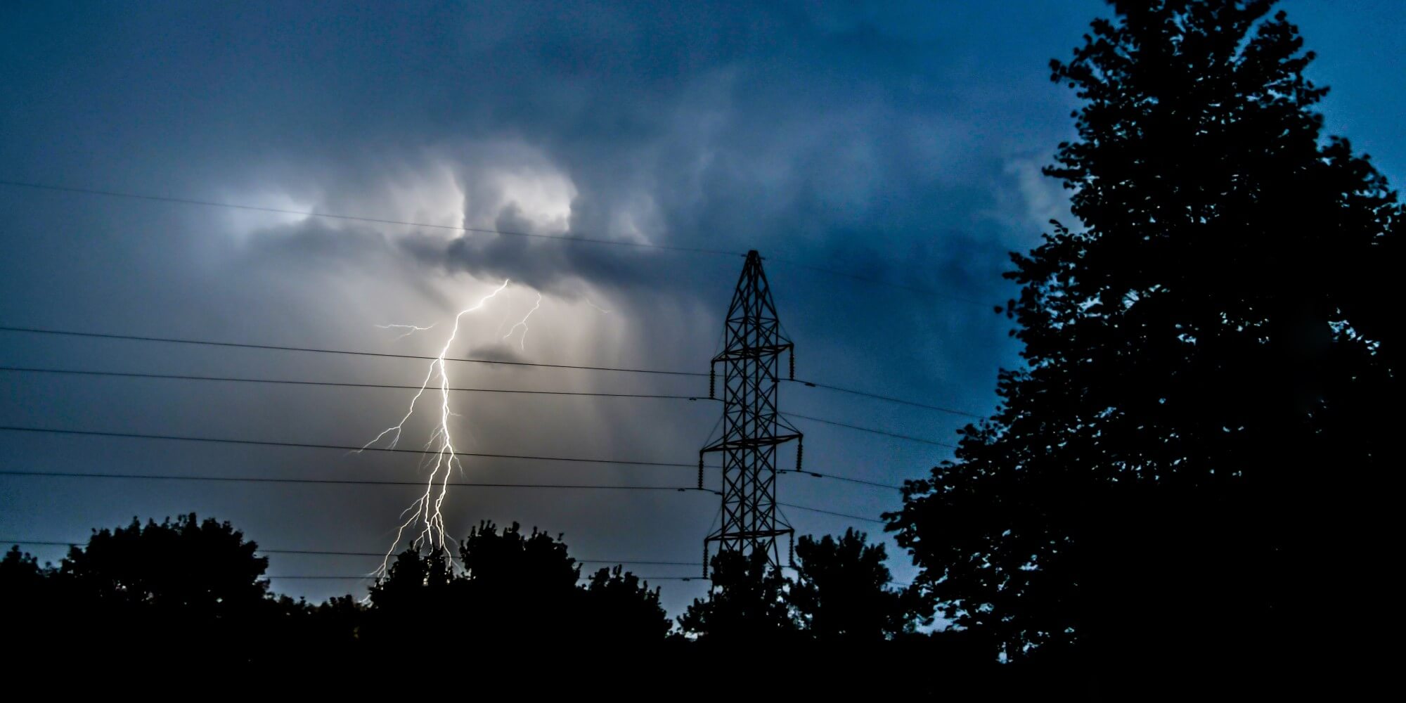 lightning bolt next to power lines